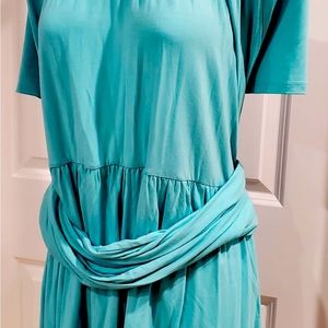 A beautiful Greek inspired top in a jewel tone blue